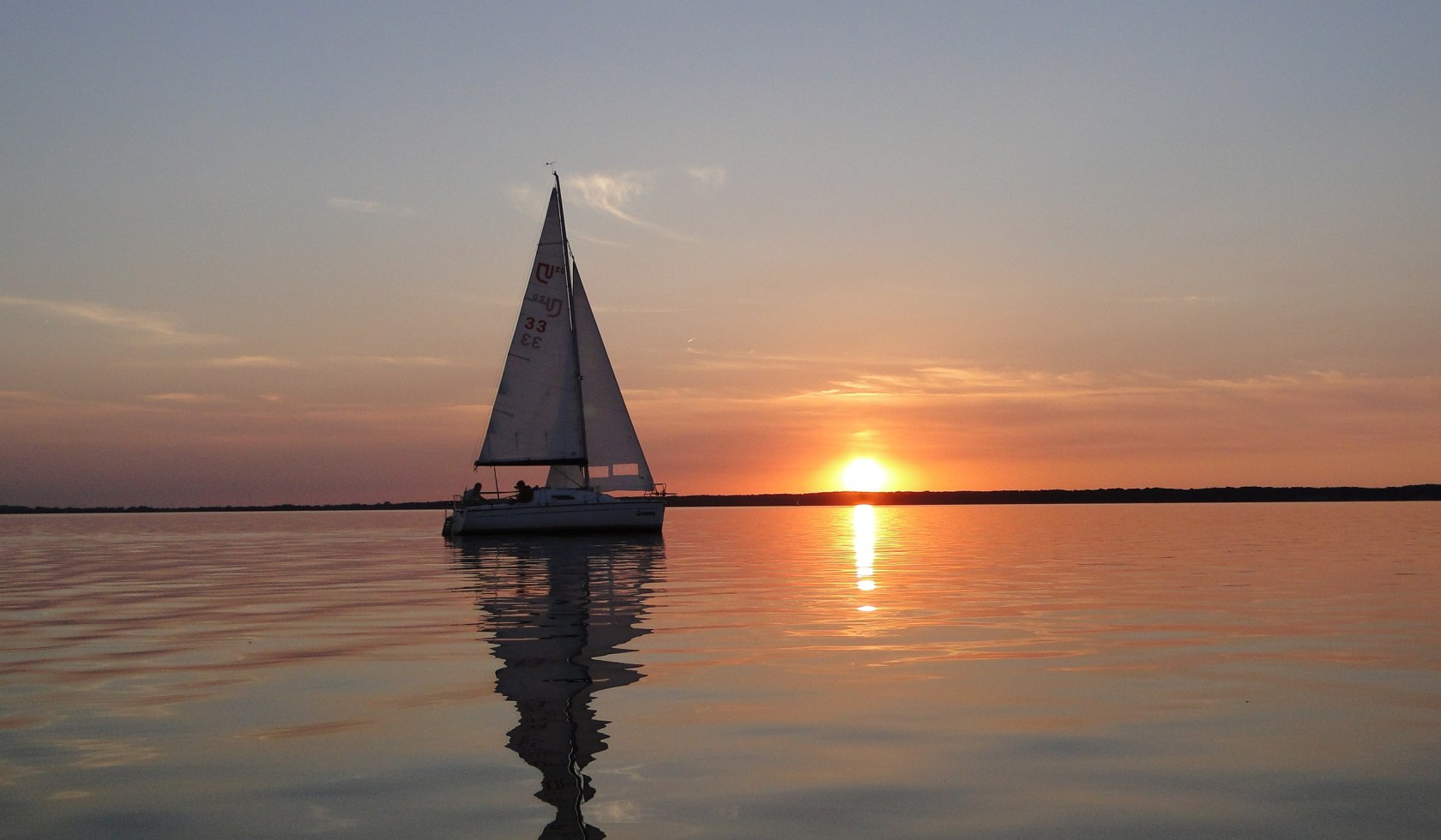 Sailing boat at sunset on the Steinhuder Meer, © SMT / Christine Kölling 