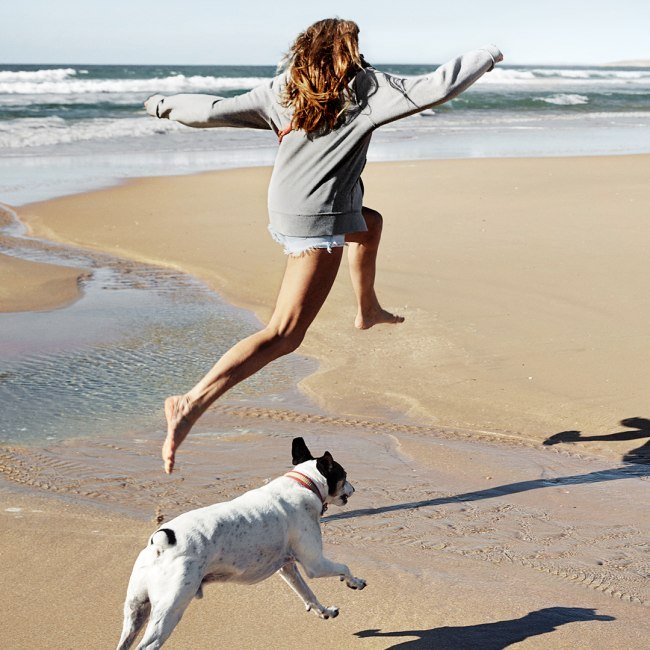 Woman with dog on the beach campaign 2020